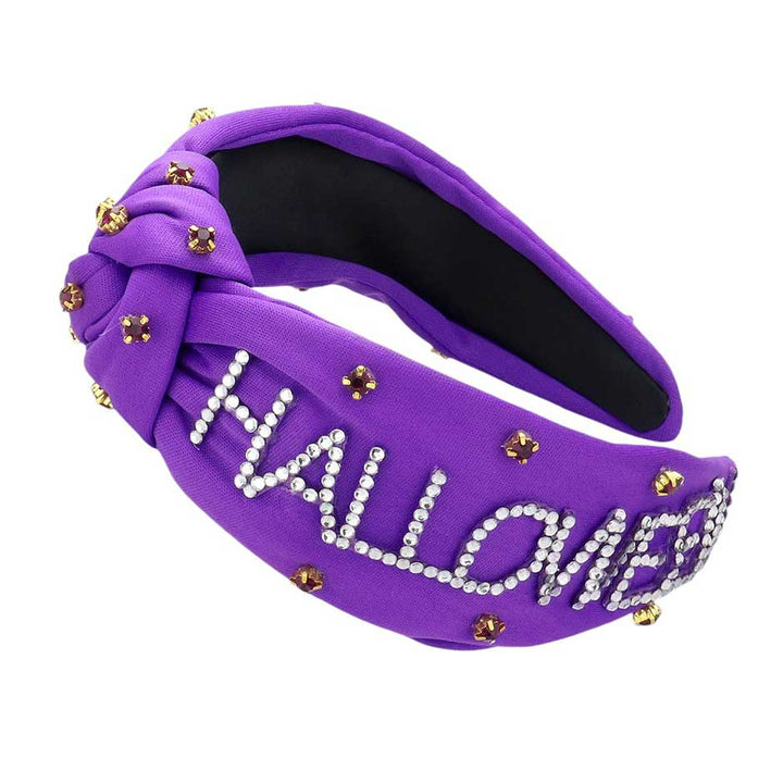 Purple-Bling Studded HALLOWEEN Message Pointed Stone Cluster Embellished Knot Headband. This unique accessory features a cluster of sparkling stones and a playful message, making it the perfect addition to any spooky look. Crafted with a knot design, this headband is both comfortable and stylish. Bring on the Halloween fun!