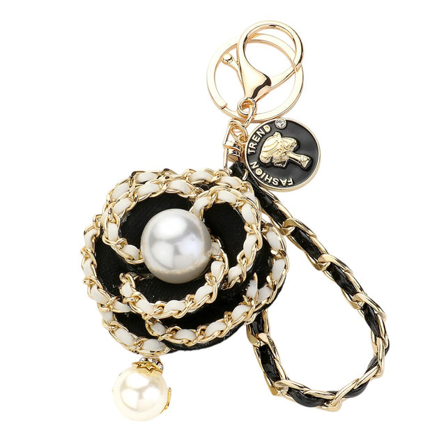 Black Gold Pearl Pointed Faux Leather Braided Chain Deco Flower Key Chain is a stylish and practical addition to any keychain collection. The chain is crafted with faux leather and features a beautiful pearl and deco flower design. It is not only fashionable but also durable and easy to attach to your keys.