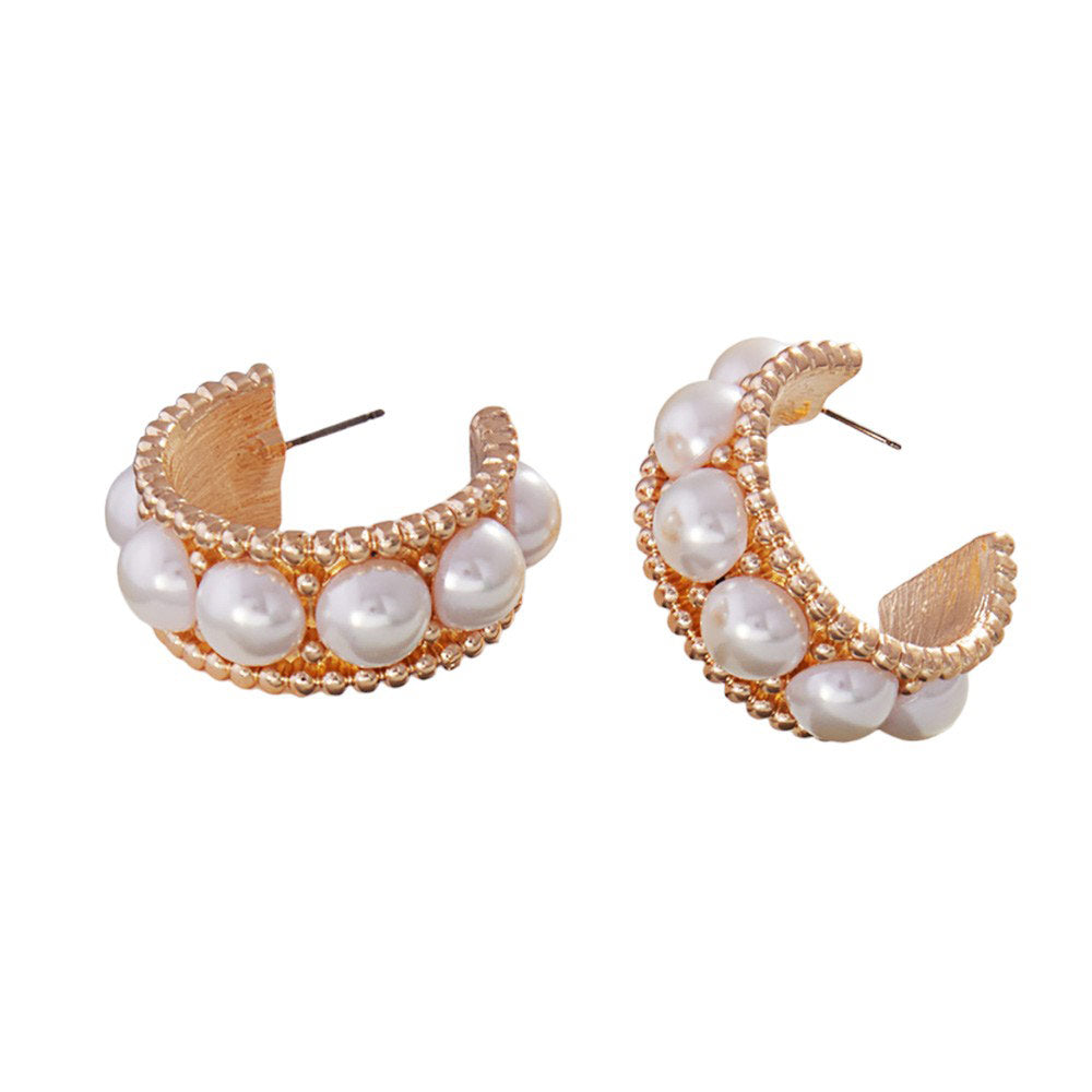 Pearl Pointed Hoop Earrings, These elegant earrings add a touch of sophistication to any outfit. The unique design features delicate pearls and a pointed hoop shape, creating a timeless and classic look. Made with high-quality materials, these earrings are a perfect addition to any jewelry collection.