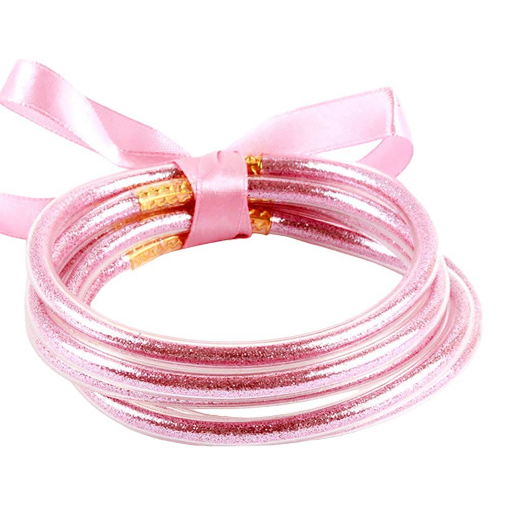 Pink 5PCS Glitter Jelly Tube Bangle Bracelets, these 5 colorful, glittered bracelets are perfect for adding a fashionable yet eye-catching touch to any outfit. Made from jelly tubes and shimmering glitter, they are durable and comfortable to wear. Add a pop of color and sparkle to your wardrobe with these stylish bracelets.