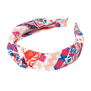 Pink Aztec Patterned Burnout Knot Headband is expertly crafted and features a unique design. Its trendy Aztec pattern and comfortable knot design are perfect for adding a touch of style to any outfit. Made with high-quality materials, it provides both functionality and fashion.