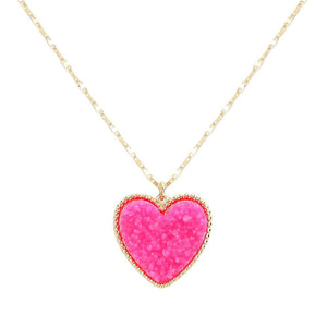 Pink Druzy Heart Pendant Necklace, this is a stunning accessory that adds a touch of sparkle to any outfit. The druzy heart pendant is beautifully crafted and catches the light for a mesmerizing effect. With its unique design and high-quality materials, this necklace is sure to make a statement and elevate your look.