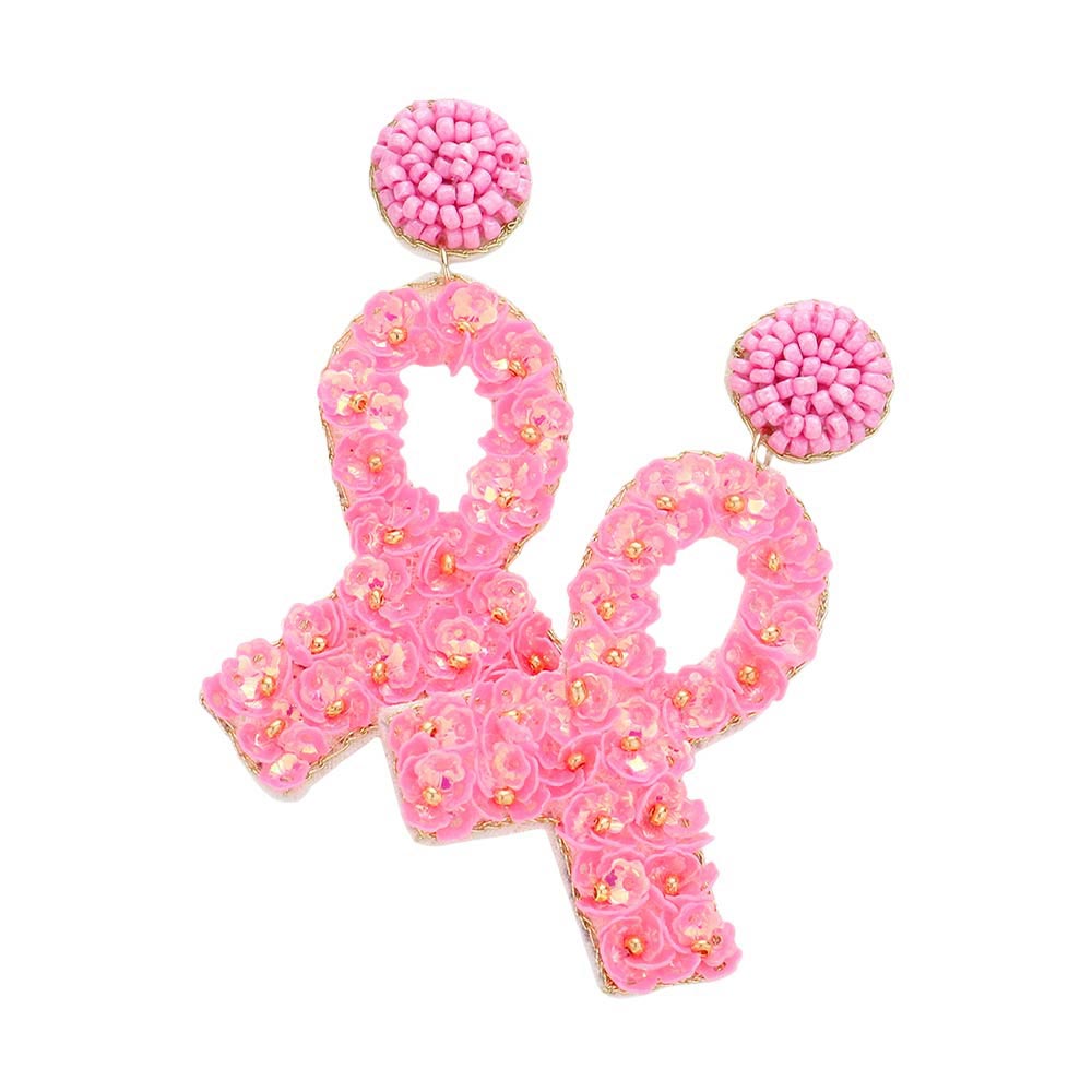 Declare your strength and courage with these beautiful Pink Ribbon dangle earrings. Crafted from felt and adorned with a delicate flower cluster, they are sure to make a bold statement as they flutter around your face. Support cancer survivors and fighters everywhere with this fashionable accessory, gift them some hope.