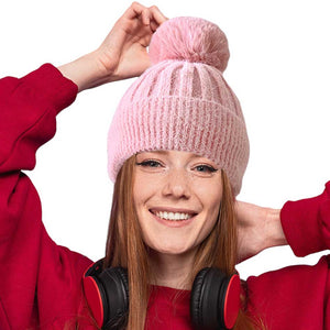 Pink Fleece Lining Pom Pom Beanie Hat, is perfect for chilly days. This stylish hat is sure to keep you warm and comfortable during the cold. Whether you're headed out for a walk or just spending time outdoors, this fashionable beanie is a great accessory. A perfect gift choice for your close people in the winter season. 