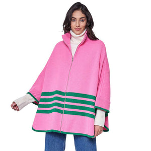 Pink Green Sporty Bordered Zip Up Knit Cape Poncho, Crafted with a cozy acrylic-blend fabric, it features a zip-up front and generous hood for extra protection against the cold. The bold, bordered design adds a classic touch, making it the perfect piece for outdoor activities. A Perfect winter gift for any occasion