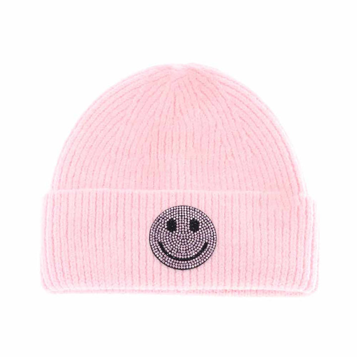 Pink KIDS Rhinestone Smiley Face Cuff C.C Beanie is expertly crafted to provide warmth and style for young wearers. Made from a soft knit fabric, it features a cuff adorned with a rhinestone smiley face, offering a playful yet refined look. It's a snug fit that ensures comfort during colder weather while adding a cheerful and trendy touch to any child's outfit. 