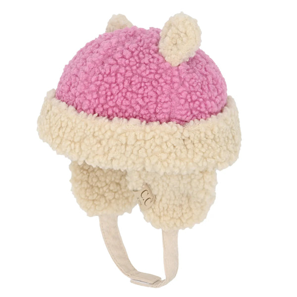 Pink KIDS Sherpa Beanie with Earflaps is designed to provide superior warmth and comfort for children during cold weather. Made from plush sherpa fabric, it offers excellent insulation, while the earflaps protect delicate ears from chilly winds. Its secure fit ensures it stays in place during active play, making it a practical and reliable choice for outdoor winter activities. Durable and easy to maintain, this beanie combines expert craftsmanship with functional design to keep kids cozy all season long. 