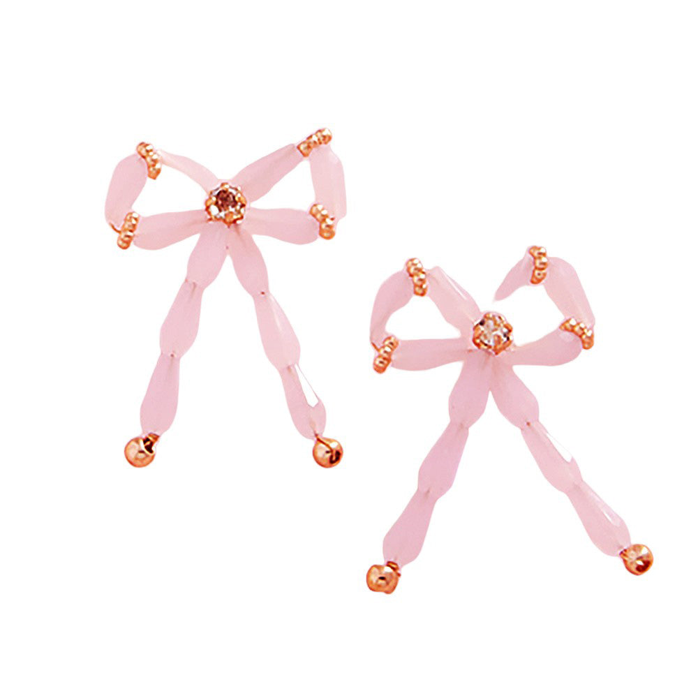 Pink Pearl Beads Bow Earrings are a timeless classic, perfect for any occasion. The elegant pearl beads add a touch of sophistication, while the delicate bow design adds a subtle feminine touch. Made with high-quality materials, these earrings are sure to make a statement.