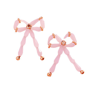 Pink Pearl Beads Bow Earrings are a timeless classic, perfect for any occasion. The elegant pearl beads add a touch of sophistication, while the delicate bow design adds a subtle feminine touch. Made with high-quality materials, these earrings are sure to make a statement.