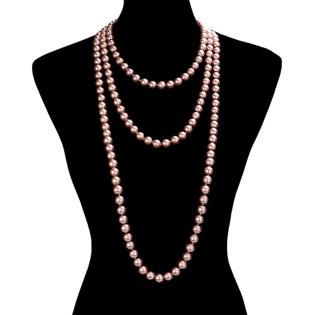 Pink Pearl Long Necklace, is the perfect marriage between timeless elegance and modern style. Handcrafted with pearls, this exquisite necklace is sure to become a staple in any jewelry wardrobe. Its contemporary design and luxurious materials make it a perfect choice for any occasion. Perfect occasional gift idea.