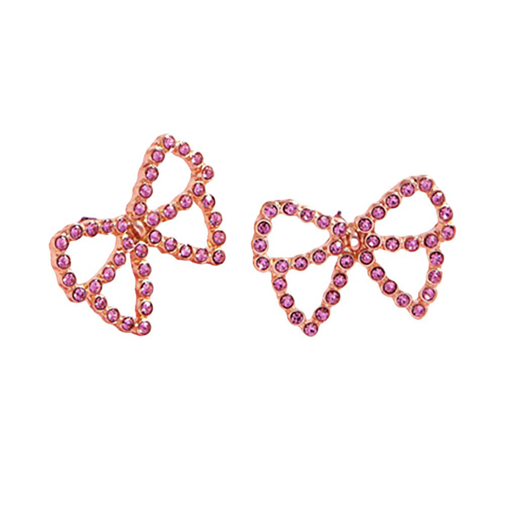 Pink Pearl Paved Bow Stud Earrings, Elevate your accessories with our exquisite earrings. With expertly paved pearls encircling a delicate bow design, these earrings add a touch of sophistication to any outfit. Perfect for any occasion, our earrings boast a timeless elegance that will never go out of style.