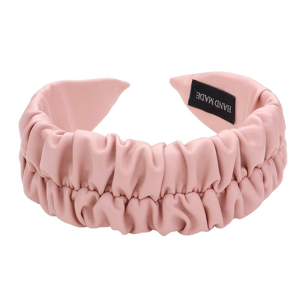 Pink Pleated Solid Faux Leather Headband, This stylish accessory adds an elegant touch to any outfit. Made with high-quality materials, it is both comfortable and durable. The pleated design offers a unique, sophisticated look, while the faux leather adds a touch of luxury. Perfect for any formal or casual occasion wear.