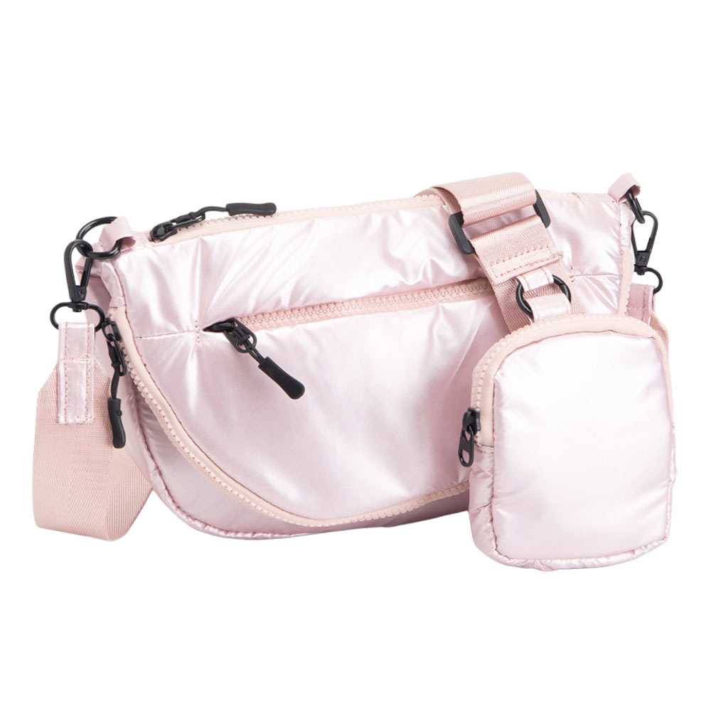 Pink Puffer Half Moon Crossbody Bag, the lightweight, stylish design features a durable water-resistant nylon that is perfect for outdoor activities. The adjustable shoulder strap makes it easy to sling across your body for hands-free convenience. Carry your essentials in style and comfort with this fashionable bag.