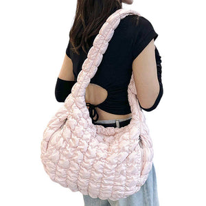 Pink Quilted Puffer Shoulder Crossbody Bag Cloud Bag, offers a sleek and stylish way to carry your essentials. Made with a unique quilted puffer design, this bag provides both durability and lightweight comfort. The perfect accessory for any occasion, it offers the perfect blend of fashion and function.