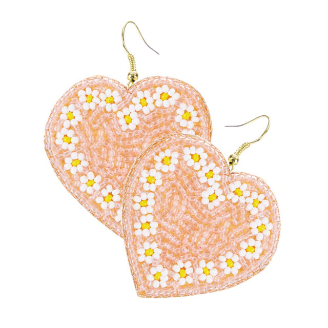 Pink Seed Beaded Heart Dangle Earrings, crafted with intricate seed bead details and feature a charming heart-shaped dangle. Add a touch of elegance and sophistication to any outfit with these stylish earrings. Perfect for any occasion, these earrings make a lovely gift for yourself or a loved one.