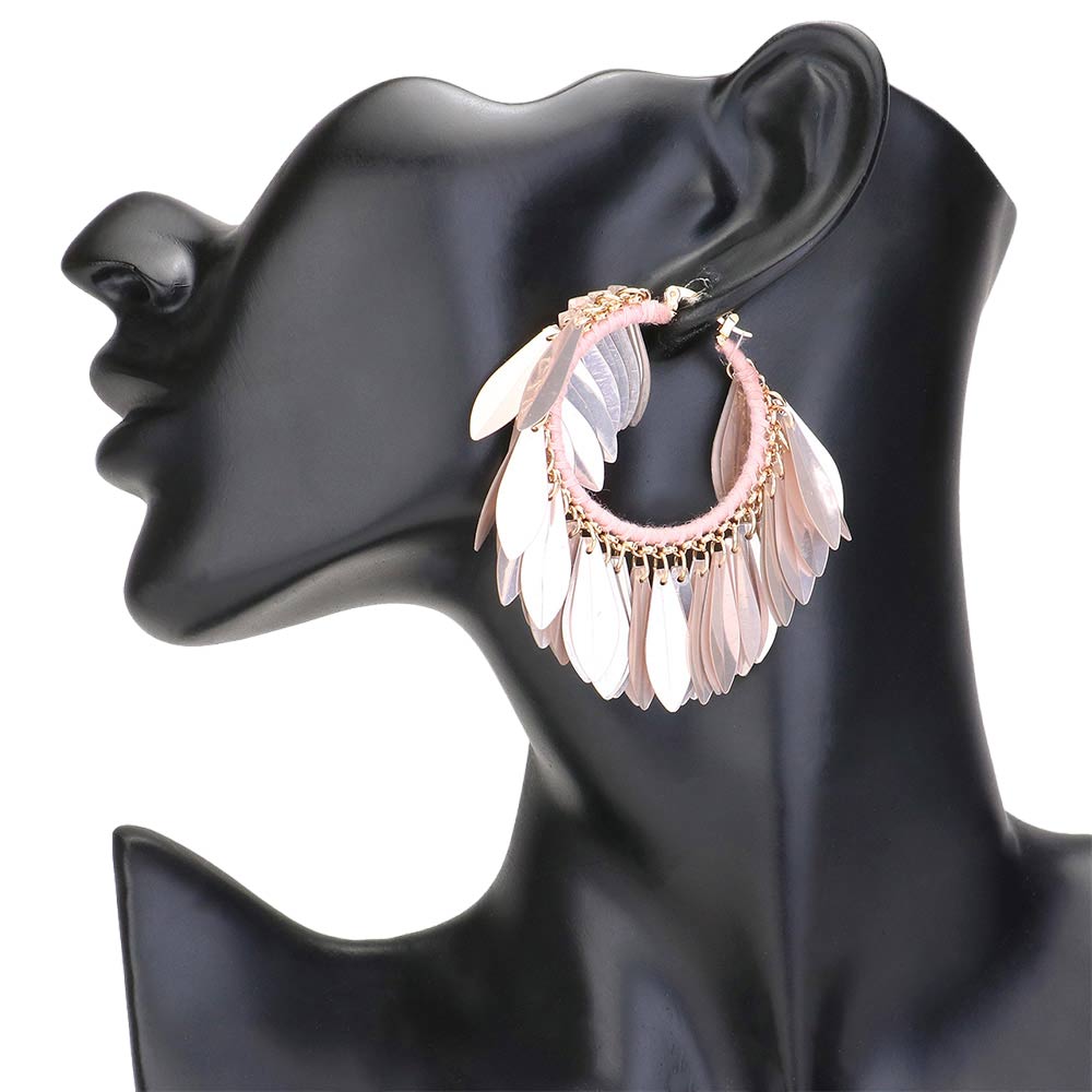 Pink Sequin Fringe Hoop Pin Catch Earrings add a touch of glamour to any outfit. The hoop design features cascading sequins for a chic and trendy look. The pin catch style ensures they will stay securely in place, making them perfect for a night out or special occasion. Ideal gift for any fashion forward individual.