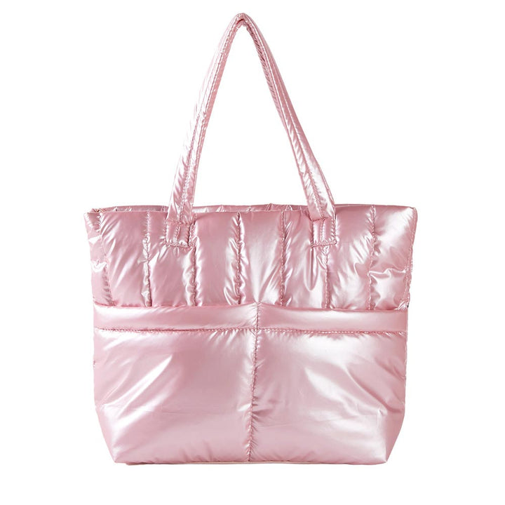 Pink Solid Puffer Tote Shoulder Bag, is an impressive combination of fashion and practicality. Made of durable material, this shoulder bag offers superior protection from impacts with its padded construction, and also features a shoulder strap for added convenience. Give one of these bags as a gift to your favorite ones.