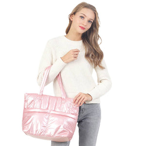 Pink Solid Puffer Tote Shoulder Bag, is an impressive combination of fashion and practicality. Made of durable material, this shoulder bag offers superior protection from impacts with its padded construction, and also features a shoulder strap for added convenience. Give one of these bags as a gift to your favorite ones.