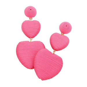 Pink Thread Wrapped Double Heart Dropdown Earrings are a versatile and stylish addition to any jewelry collection. The unique design features two intertwined hearts, symbolizing love and unity. Crafted with high-quality materials, these earrings are lightweight and comfortable to wear. Perfect for any occasion or daily wear
