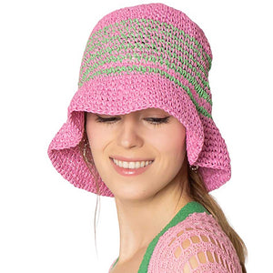 Pink Two-Tone Stripe Straw Bucket Hat, Stay cool and stylish with the stylish summer hat. This quirky hat features a unique two-tone stripe design that adds a touch of fun to any outfit. Keep the sun out of your eyes while adding a playful flair to your look. Perfect for a day at the beach or a casual outing.