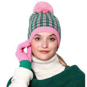 Pink & Green Check Patterned Pom Pom Beanie Hat. This knitted beanie features a classic check pattern in multiple color options and a luxurious pom pom. It’s perfect for any cold weather activity and adds a colorful touch to any outfit. Ideal for gifting to your friends and family members or to treat yourself on chilly days.