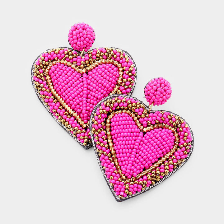 Pink Seed Bead Heart Earrings are handcrafted with tiny seed beads, making them lightweight and comfortable to wear. Perfect for adding a touch of whimsy to any outfit, these earrings are ideal for everyday wear or special occasions. The unique heart shape adds a romantic and playful touch to your look.