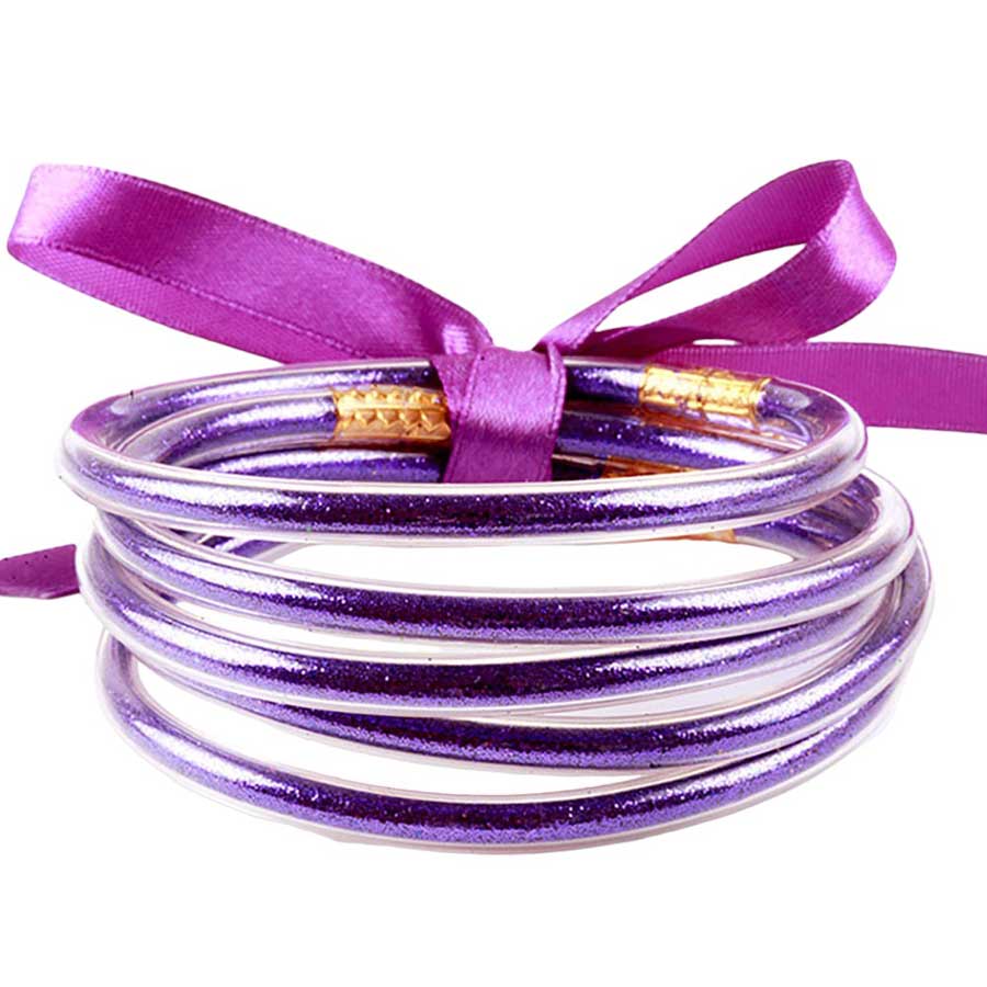 Purple 5PCS Glitter Jelly Tube Bangle Bracelets, these 5 colorful, glittered bracelets are perfect for adding a fashionable yet eye-catching touch to any outfit. Made from jelly tubes and shimmering glitter, they are durable and comfortable to wear. Add a pop of color and sparkle to your wardrobe with these stylish bracelets.