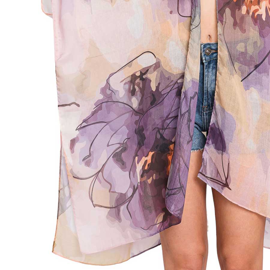 Purple Abstract Watercolor Leaves Print Kimono Poncho adds a touch of elegance to any outfit with its unique and modern print design. Made from high-quality materials, this versatile poncho provides both style and comfort. Perfect for any occasion, this kimono poncho is a must-have for any fashion-forward individual.
