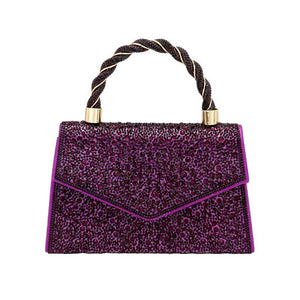 Purple Bling Top Handle Evening Crossbody Bag, is the perfect accessory to complete any outfit. The durable construction and fashionable design of this bag make it ideal for special occasions. With enough space for a cell phone, lipstick, and other essential items, you'll never be without the perfect accessory.
