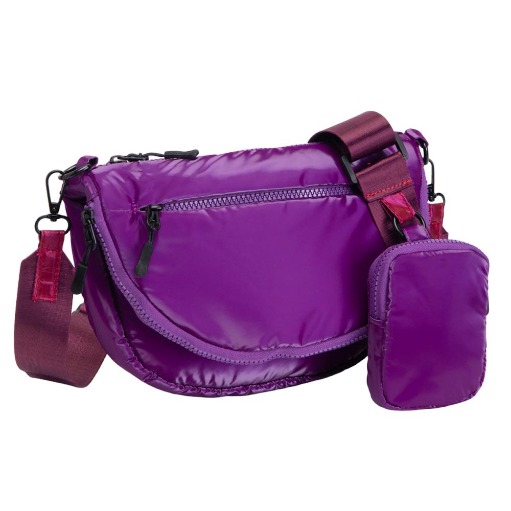 Purple Glossy Puffer Half Moon Crossbody Bag, the lightweight, stylish design features a durable water-resistant nylon that is perfect for outdoor activities. The adjustable shoulder strap makes it easy to sling across your body for hands-free convenience. Carry your essentials in style and comfort with this fashionable bag.