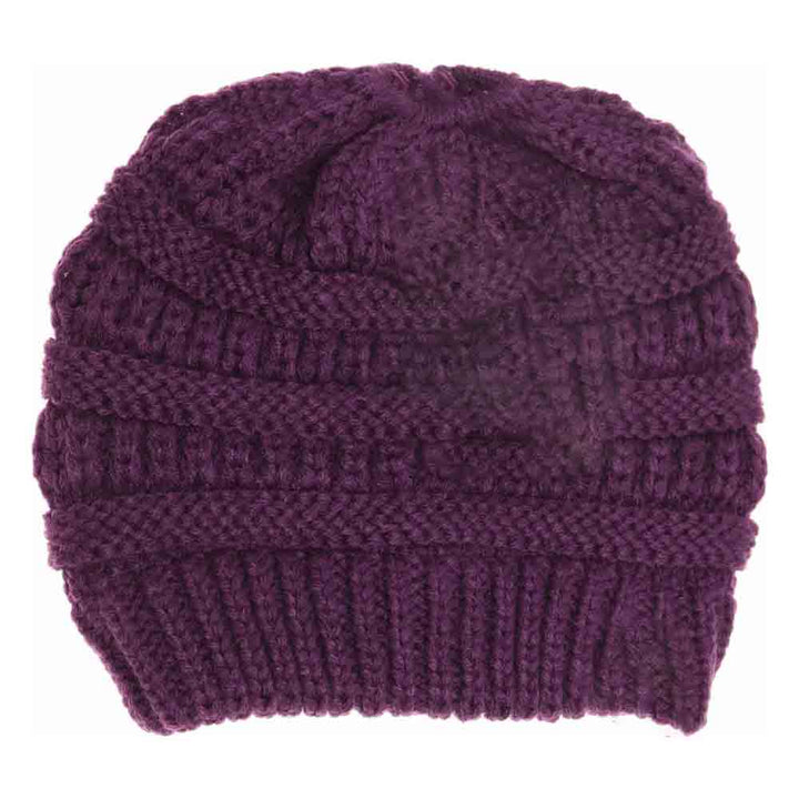 Purple Kids Solid Classic CC Beanie Tail combines timeless style with practical comfort. Designed with a soft, durable fabric, it provides warmth while allowing a ponytail or bun to fit through the open tail hole comfortably. Ideal for active children, this beanie ensures a secure and cozy fit during outdoor activities in cooler weather. Its solid color and classic design make it versatile for everyday wear or layering under helmets and hoods.