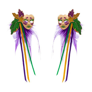 Purple Mardi Gras Masquerade Mask Feather Earrings, offer a unique way to complete your masquerade party outfit. The earrings feature a detailed mask design with colorful feathers and provide a comfortable fit. Enjoy the luxurious look of a festive masquerade costume. Perfect for holiday gifts.