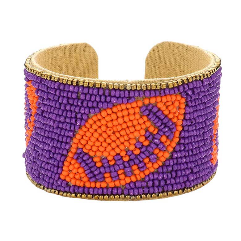 Navy Orange Game Day Seed Beaded Football Accented Cuff Bracelet, Show your love for the game with the Game Day Seed Beaded Football Accented Cuff Bracelet. It features a football design accent to create a unique and fashionable look. Perfect for any game day, this bracelet is sure to add a touch of team spirit to your wardrobe.