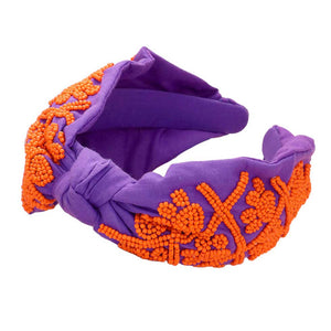 Purple Orange Be ready for game day with this stylish and comfortable Game Day Seed Beaded Paw Knot Burnout Headband. This headband is made from lightweight polyester and features a burnout design of paw knots with seed beads. Perfect for everyday wear, it's sure to make a statement and show your team spirit. 