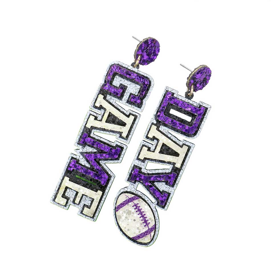 Purple White Game Day Message Football Bling Dangle Earrings, feature a sparkling crystal football and message charms with a metallic finish. Show your team spirit with these whimsical earrings. The perfect accessory for the biggest game days and the perfect gift for sports lovers. 