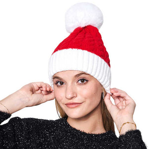 Red Cable Knit Faux Fur Pom Pom Beanie Hat, is the perfect choice to stay warm during the cold winter months. Crafted from a cozy and soft cable knit design, and completed with an adorable faux fur pom pom, this beanie is sure to turn heads. Perfect gift choice for the Christmas festival.