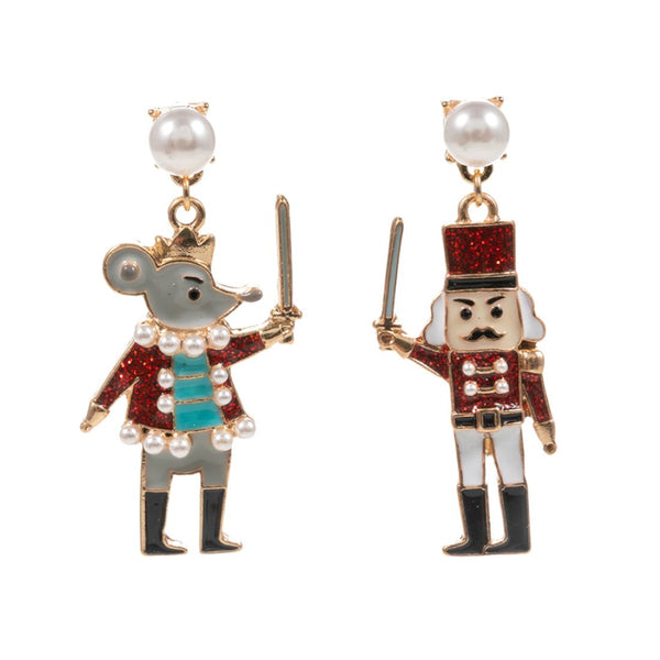 Add a touch of festive charm to your holiday look with these Enamel Nutcracker Mouse King Dangle Earrings. Designed in vibrant red enamel with a delicate pearl accent, these earrings capture the magic of Christmas with whimsical elegance.