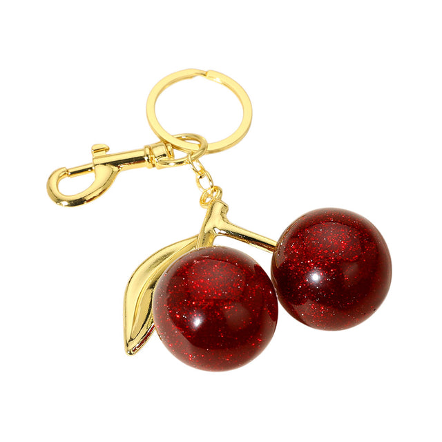 Red Glittered Cherry Bag Charm is the perfect accessory to add some sparkle to your bag. The glitter adds a touch of glam, while the cherry design is both playful and stylish. With this charm, your bag will not only stand out, but you'll also be on-trend. 