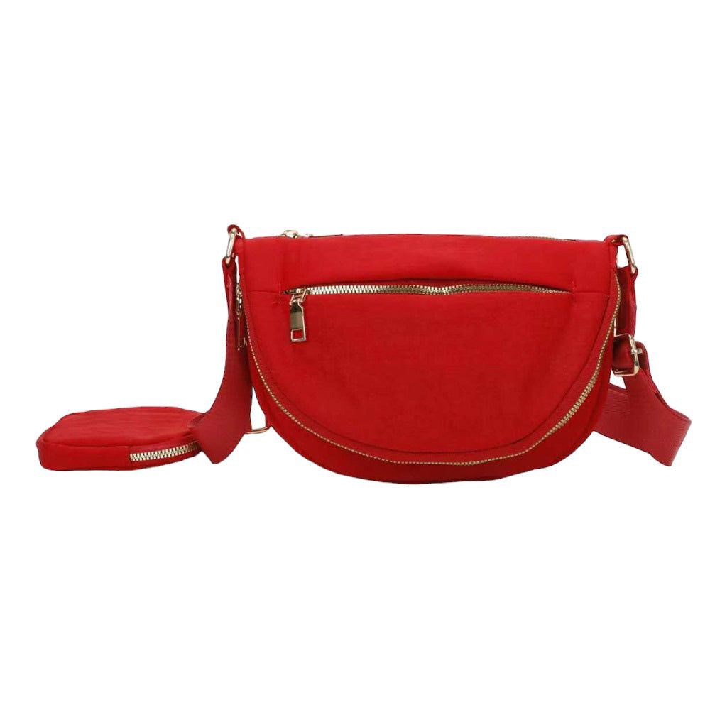 Red Half Round Solid Nylon Crossbody Bag, is made of nylon, making it lightweight and durable. The adjustable shoulder strap ensures it will be comfortable to carry. The half-round shape adds a unique look to this bag, making it a great choice for any occasion. Perfect gift for fashion-forwarded family members and friends.