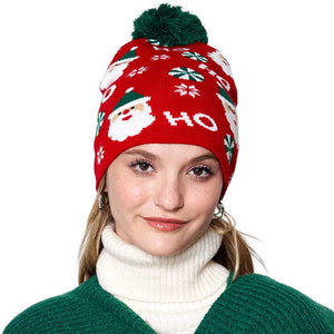 Red HoHoHo Message Santa Claus Candy Cane Pom Pom Beanie Hat. It's perfect for gifting to your loved ones on Christmas, or to treat yourself. Featuring an iconic message from Santa Claus himself, HoHoHo, this hat is perfect for spreading the cheer! It is an ideal winter accessory.