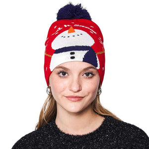 Red Let it Snow Message Snowman Snowflake Pom Pom Beanie Hat. Stay cozy and stylish this winter season with this. Featuring a festive Christmas theme complete with a snowman, snowflakes, and a luxuriously soft pom pom, this beanie hat is perfect for cold-weather wear. Enjoy the utmost warmth and comfort all winter long.