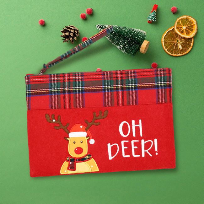 Compact holiday pouch featuring a festive reindeer and "Oh Deer!" message. Accented with classic plaid and wrist strap, ideal for holding small gifts, makeup, or essentials during the holiday season.