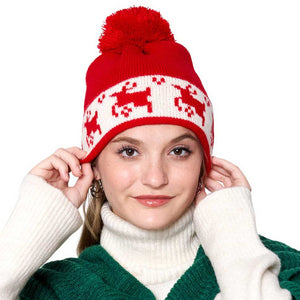 Red Reindeer Holiday Pom Pom Beanie Hat, is the ideal accessory to complete your winter wardrobe in this Christmas. It features a comfortable ribbed knit construction, with a decorative reindeer design and a festive pom-pom topper. Keep your head warm and stay stylish in this. Perfect winter season festival gift idea.