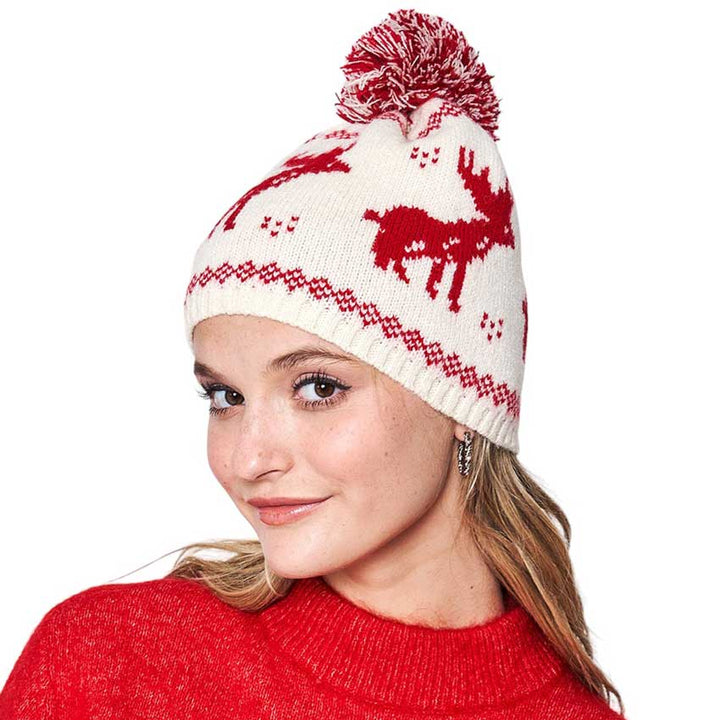 Red Reindeer Nordic Pom Pom Beanie Hat, is perfect for enhancing any outfit all year round. It features a knitted texture and extra fluffy pom pom detailing for added warmth and protection. Keep yourself warm while looking great with this cozy winter hat in this Christmas festive and make a nice gift with this.