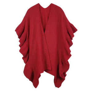 Red This Reversible Ruffle Sleeves Knit Ruana Poncho adds the perfect touch of sophistication to your look. Crafted from 100% Polyester this poncho features reversible sleeves with a unique ruffle design.  Easy to wear and care for, it's a must-have for any wardrobe. Excellent choice as a gift item for your loved ones. 