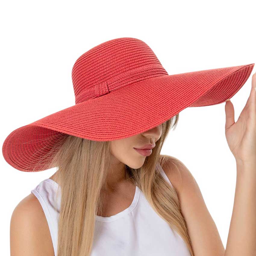 Red Solid Floppy Straw Sun Hat, Stay stylish and protected from the sun with our sun hats! Made from high-quality straw, this hat is perfect for any sunny day. Its floppy design not only looks fashionable but also provides ample shade for your face and neck. Don't forget to pack this accessory for your next beach trip!