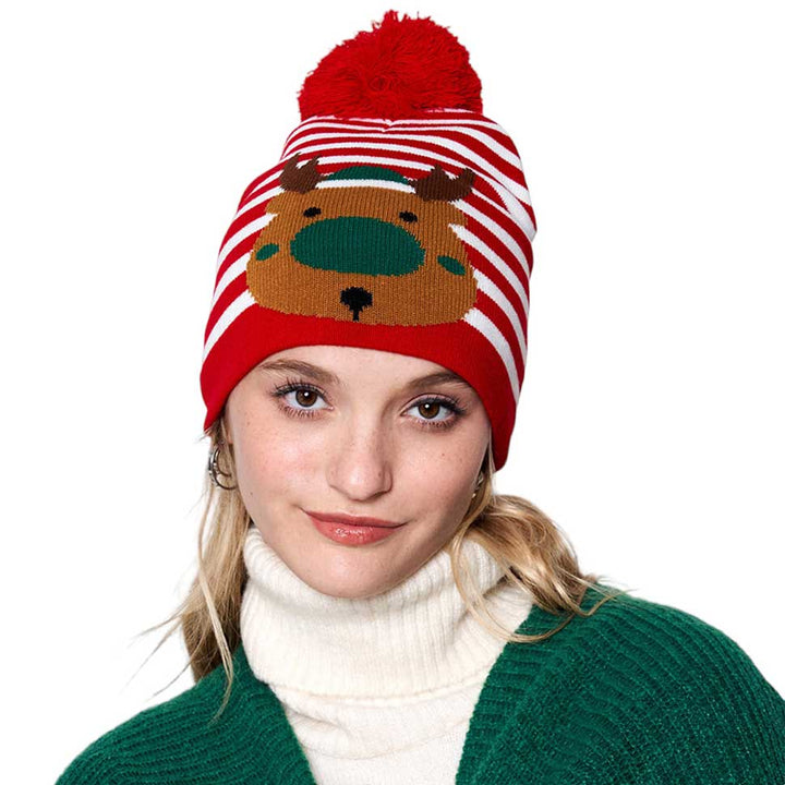 Red Striped Rudolph Pom Pom Beanie Hat, will keep you warm and cozy during winter months. Featuring a classic striped design, this hat also comes with an added pom pom detail, making it a great fashion accessory. Perfect for gifting to friends and family, it's a stylish and practical choice in the chilly Christmas Days. 