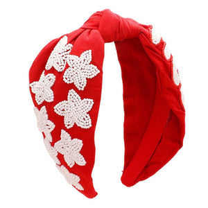 Red White Get ready for the game with this Game Day Seed Beaded ACE Message Star Knot Burnout Headband. Crafted with soft material and adorned with seed beading, an ACE message, and a star knot, this headband is perfect for making a statement and staying comfortable at the same time. Cheer up your favorite team with this.