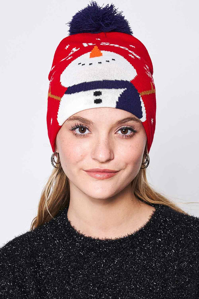 Red Let It Snow Christmas Holiday Pom Beanie features festive holiday lettering topped with a fluffy pom for a fun and cheerful winter look. Made with a soft stretch fit, it keeps you warm and cozy while adding playful Christmas spirit to your cold-weather outfits.