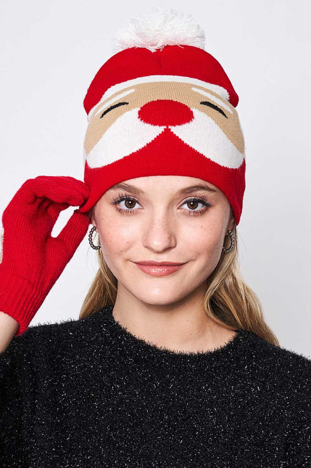 Red Santa Christmas Holiday Pom Beanie features cheerful Santa-themed detailing topped with a fluffy pom for a classic festive winter look. Designed with a soft stretch fit, it keeps you warm and cozy while adding joyful holiday charm to your cold-weather outfits.